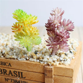 Yellow-green and burgundy artificial succulent branches shown side by side, with clustered leaf heads.
