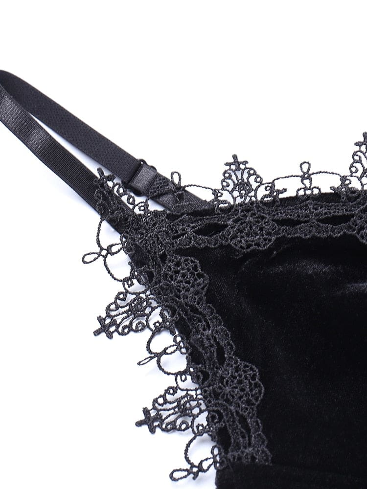 Close-up of the black shoulder strap slider beside the intricate lace neckline trim on the velour dress.
