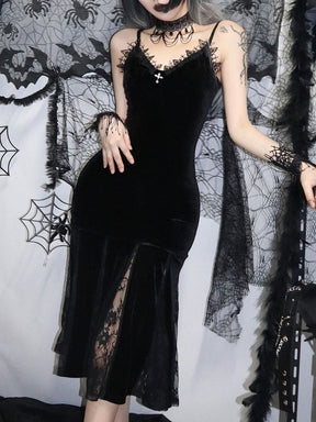 Straight-on styled view of the black velour midi dress, with a small cross at the neckline and tall sheer floral panels in the lower skirt.