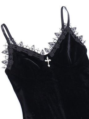 Close view of the black velour bodice, with delicate looped lace along the neckline and a small silver-tone cross at the center.