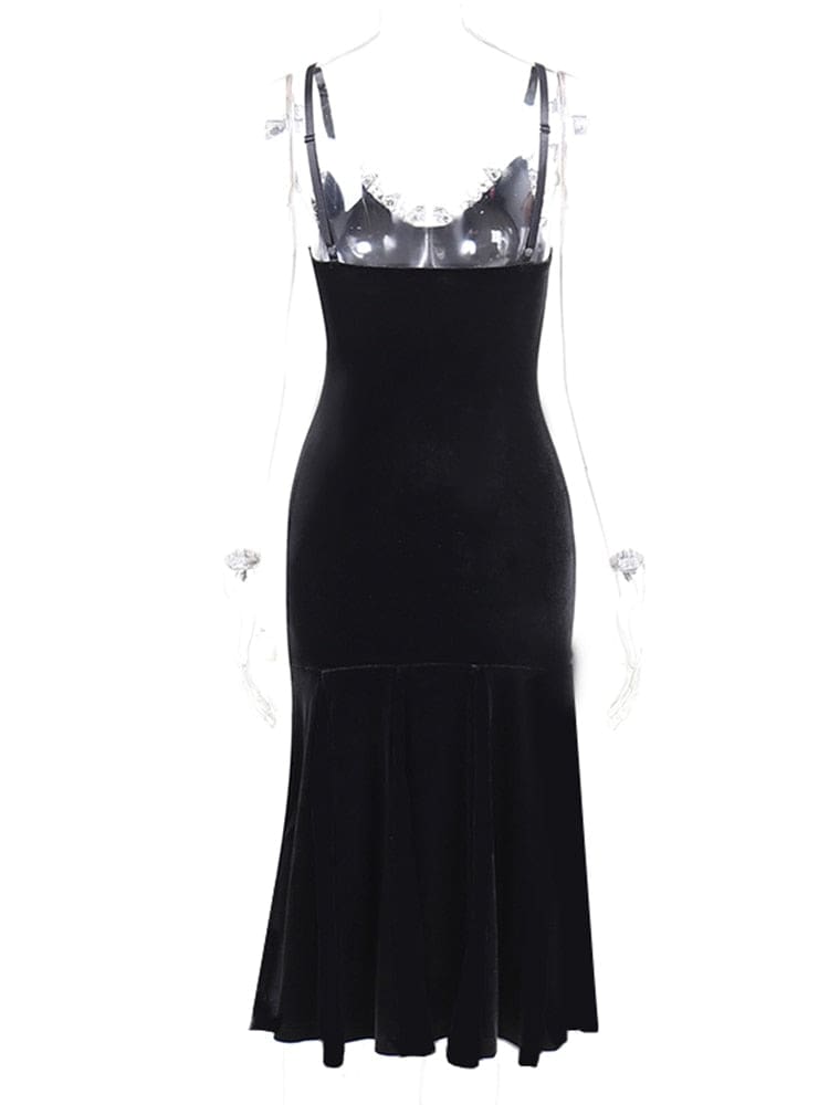 Back view of the black velour dress on a clear mannequin, showing its straight low back and plain black flared skirt.