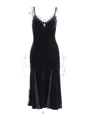 At the Altar black velour dress on a clear mannequin, with a fitted body and alternating opaque and sheer floral panels in the midi skirt.