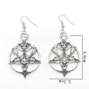 Silver-tone Baphomet earrings on white with a measurement guide marking the drop motif as 4.6cm high and 3.5cm wide, excluding the ear wire.