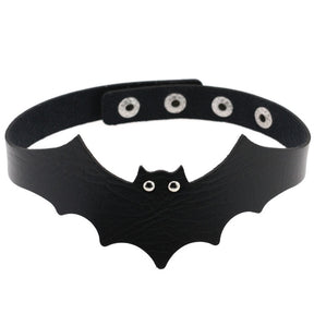 Black faux leather bat wing choker shown fastened in a circle, with a scalloped front, pointed ears and two silver-tone eyelet eyes. The adjustable snap positions are visible across the back.