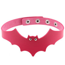 Fuchsia faux leather bat wing choker shown fastened in a circle, with a scalloped front, pointed ears and two silver-tone eyelet eyes. The adjustable snap positions are visible across the back.