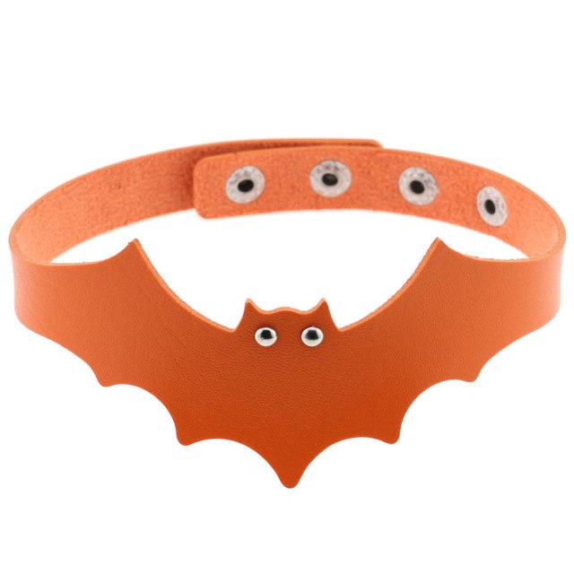 Orange faux leather bat wing choker shown fastened in a circle, with a scalloped front, pointed ears and two silver-tone eyelet eyes. The adjustable snap positions are visible across the back.