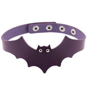Purple faux leather bat wing choker shown fastened in a circle, with a scalloped front, pointed ears and two silver-tone eyelet eyes. The adjustable snap positions are visible across the back.