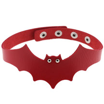 Red faux leather bat wing choker shown fastened in a circle, with a scalloped front, pointed ears and two silver-tone eyelet eyes. The adjustable snap positions are visible across the back.