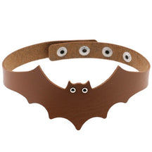 Tan faux leather bat wing choker shown fastened in a circle, with a scalloped front, pointed ears and two silver-tone eyelet eyes. The adjustable snap positions are visible across the back.