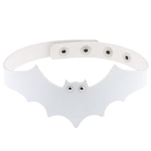 White faux leather bat wing choker shown fastened in a circle, with a scalloped front, pointed ears and two silver-tone eyelet eyes. The adjustable snap positions are visible across the back.