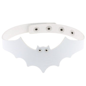 White faux leather bat wing choker shown fastened in a circle, with a scalloped front, pointed ears and two silver-tone eyelet eyes. The adjustable snap positions are visible across the back.