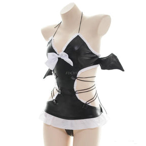 Angled mannequin view showing a pointed bat wing, white bow and lacing across the lingerie set's open waist.