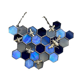 Bee and honeycomb stained glass hanging in the Blue Honeycomb design with cool-toned hexagons and bee accents.