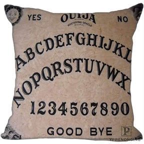 Muted beige square Ouija cushion cover with classic black alphabet rows, numbers, sun-and-moon faces and Good Bye lettering.