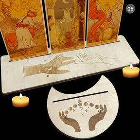 Beige tarot stand pair with reaching hand artwork, showing one rectangle and one moon-shaped holder with narrow card slots.