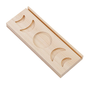 Light beige wooden moon phase tarot stand isolated against white, showing its rectangular base, rear groove and five recessed shapes.