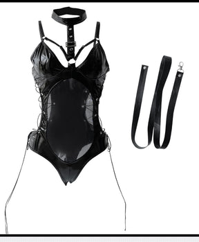A person wearing a black latex bodysuit with a snug fit, including leather-look accents and mesh details. 