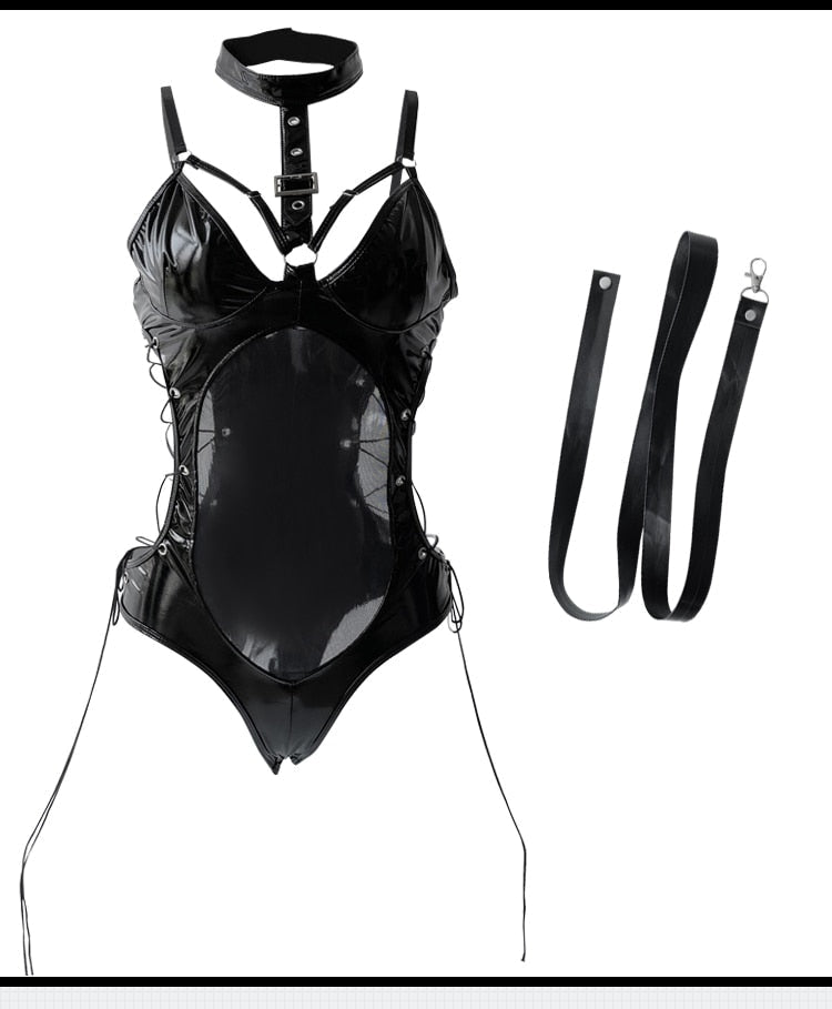A person wearing a black latex bodysuit with a snug fit, including leather-look accents and mesh details. 