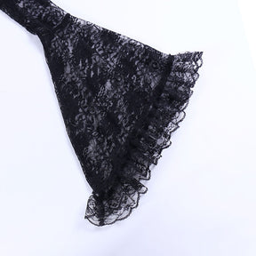 Close view of the overlay's black bell sleeve spreading into a wide ruffled floral-lace cuff.