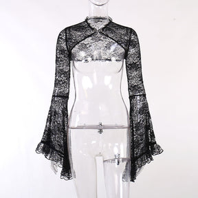Front view of the black baroque lace overlay on a clear mannequin, showing the clasp at the neck and curved open front.
