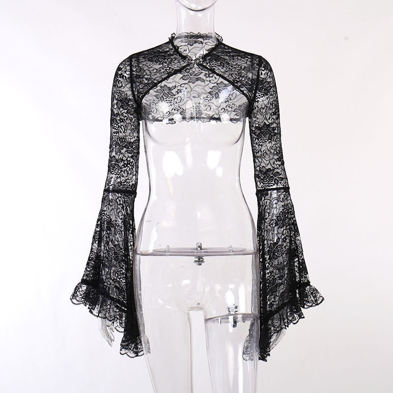 Front view of the black baroque lace overlay on a clear mannequin, showing the clasp at the neck and curved open front.