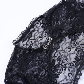 Black lace overlay neckline with ruffled trim and an ornate silver-tone clasp, photographed on white.