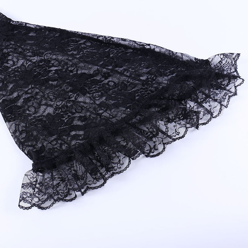 Detail of the black lace sleeve hem, showing layered ruffles along the wide bell cuff.