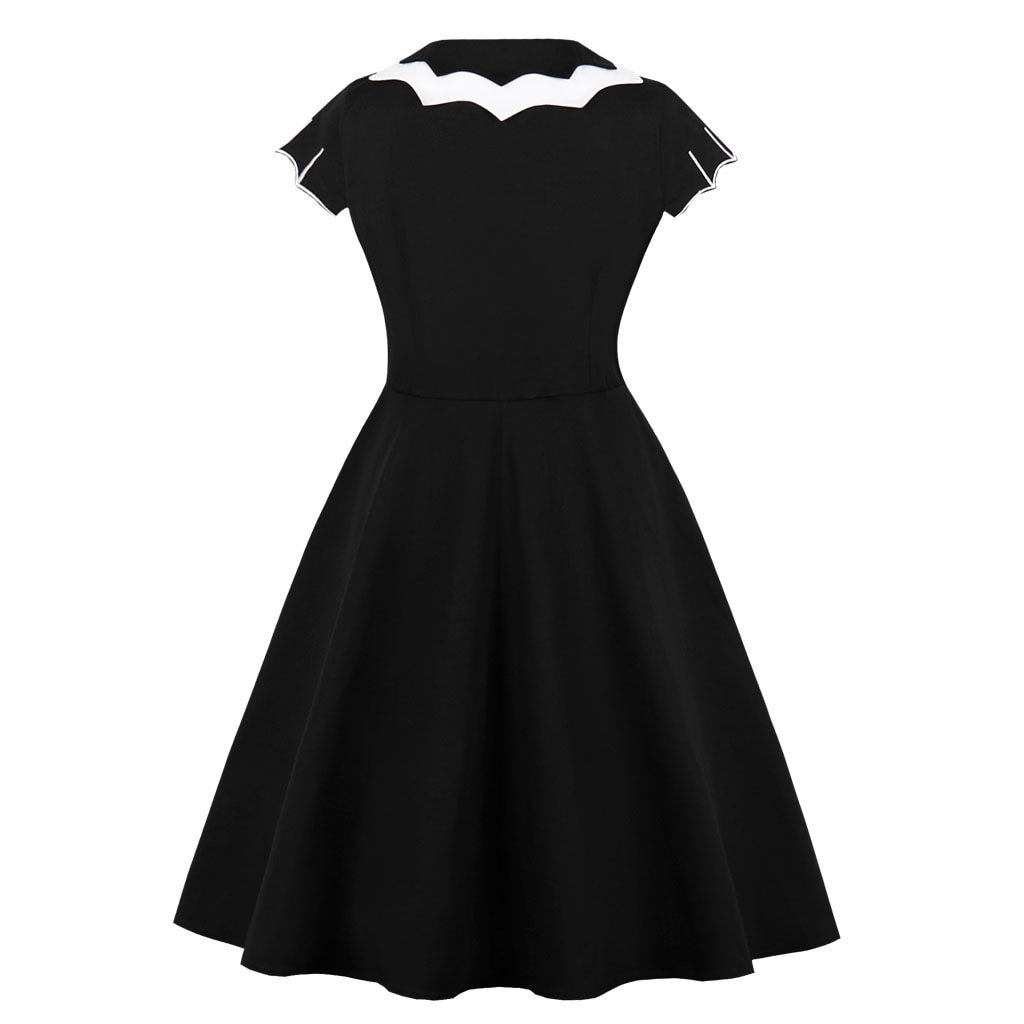 Back view of the black swing dress displayed alone, showing the contrasting collar and plain skirt.