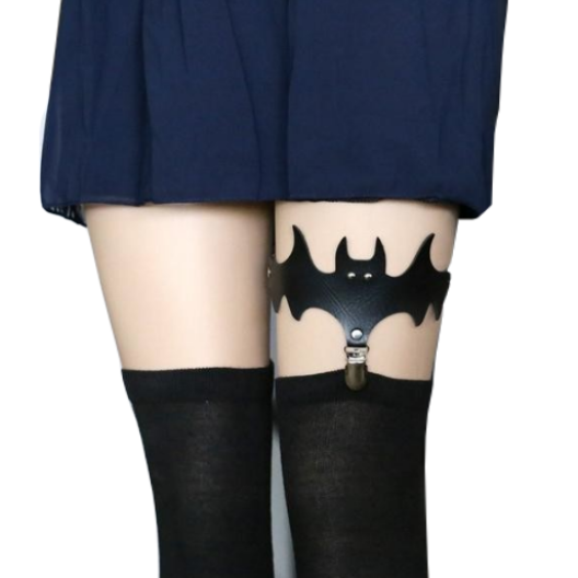 Black bat leg garter worn with stockings beneath a dark blue skirt, showing the clip at the stocking top.