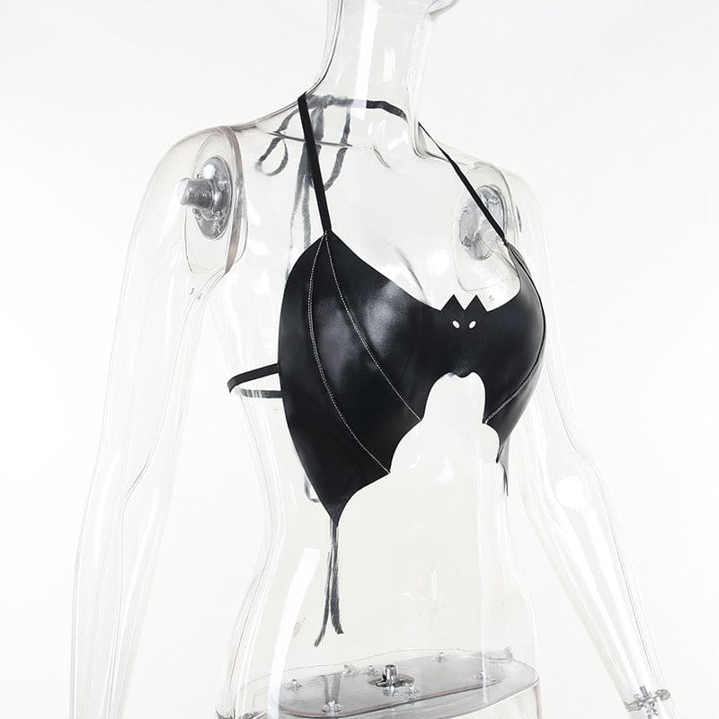 Side view of the bat-shaped bralette on a clear mannequin, showing the curved front panel and narrow straps around the neck and back.