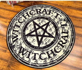 Full view of the round witchcraft rug lying flat, with elemental words around the central star.