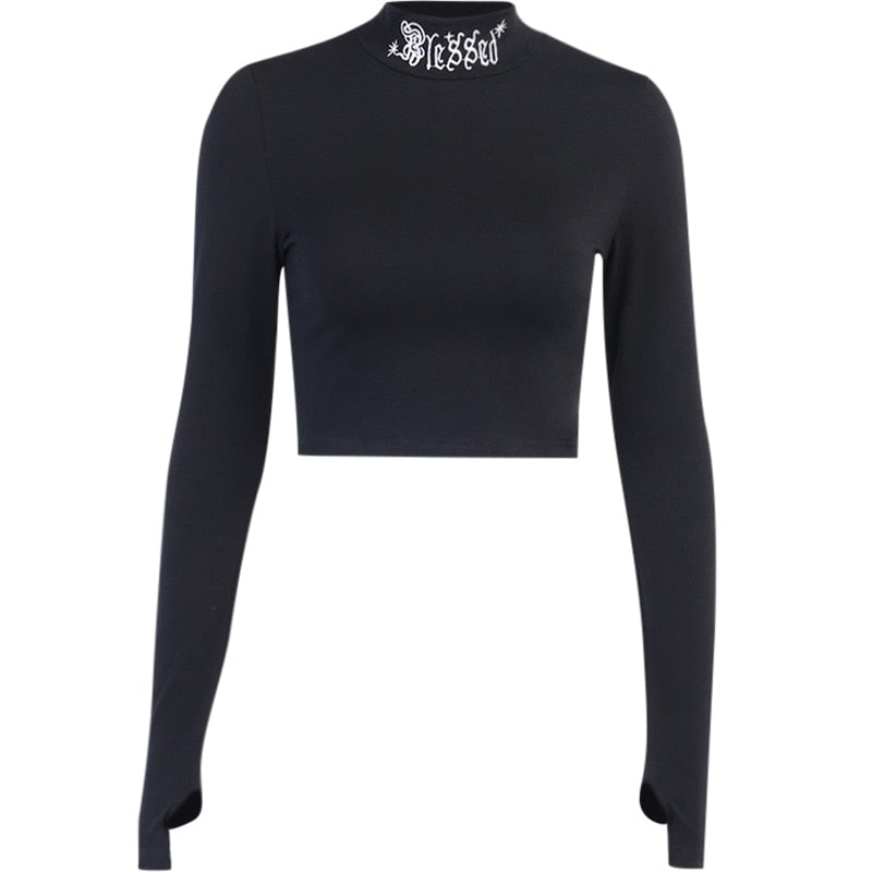 Black Blessed embroidered turtleneck crop top displayed alone on white.