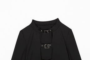 Upper front of the black crop top laid flat, showing the rounded neck band and two rectangular buckle fastenings.