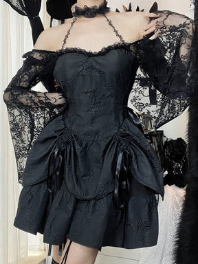 Black gothic mini dress modeled with the arms raised, showing the attached choker, lace bell sleeves and gathered butterfly-textured skirt. Black butterfly wall decorations frame the outfit.