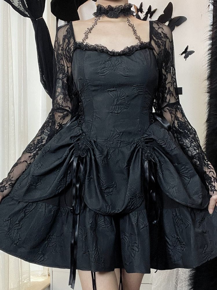 Black gothic dress modeled from the front with the arms lowered, showing the full shape of the long lace bell sleeves and the flared layered skirt.