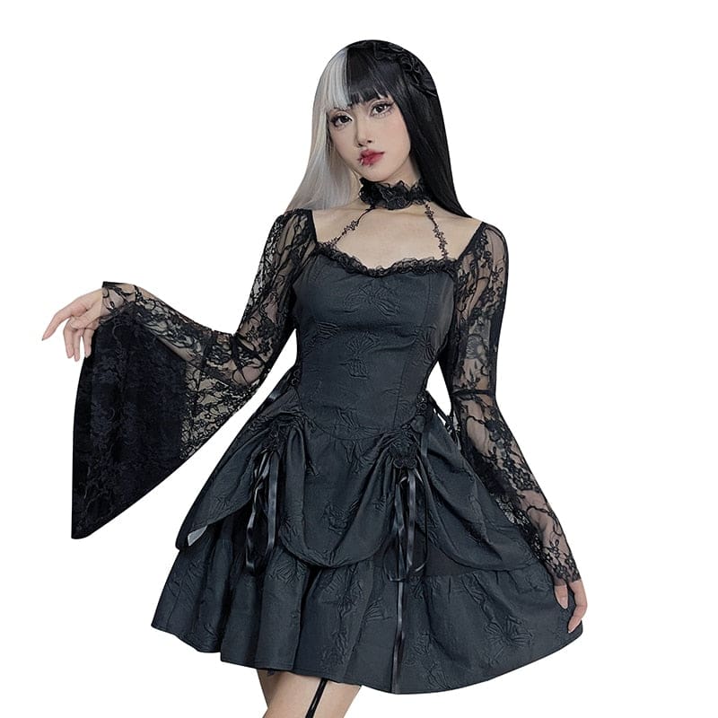 Black Dark Chapel dress modeled against a plain white background with a lace sleeve extended and the layered skirt spread to show its shape.