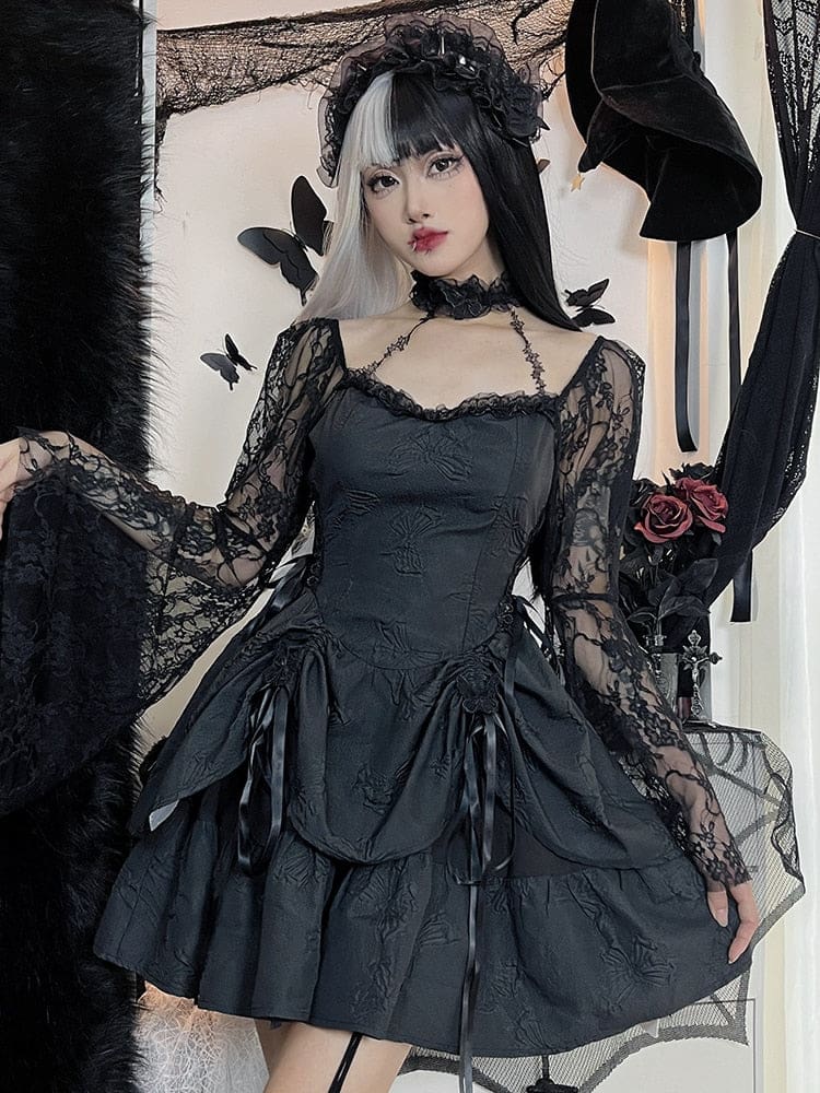 The black gothic dress modeled with one lace sleeve held out to show its broad bell shape. Ribbon-gathered panels and butterfly texture detail the mini skirt.