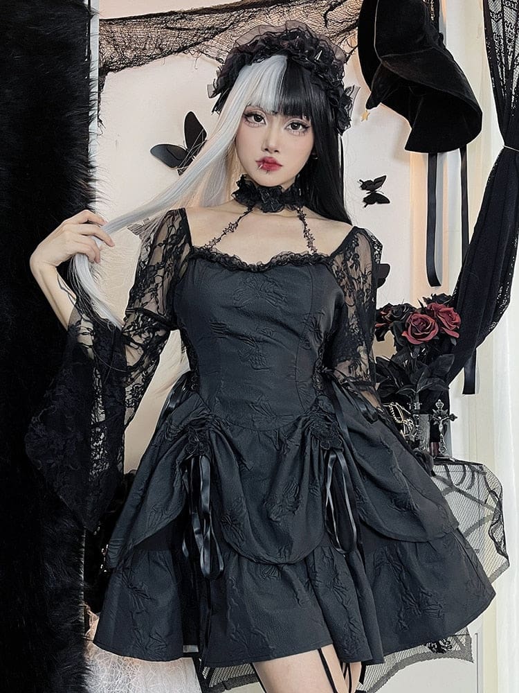 Model wearing the black butterfly mini dress with split black-and-gray hair and a dark veil, holding a strand of hair. Lace bell sleeves frame the fitted bodice and gathered skirt.