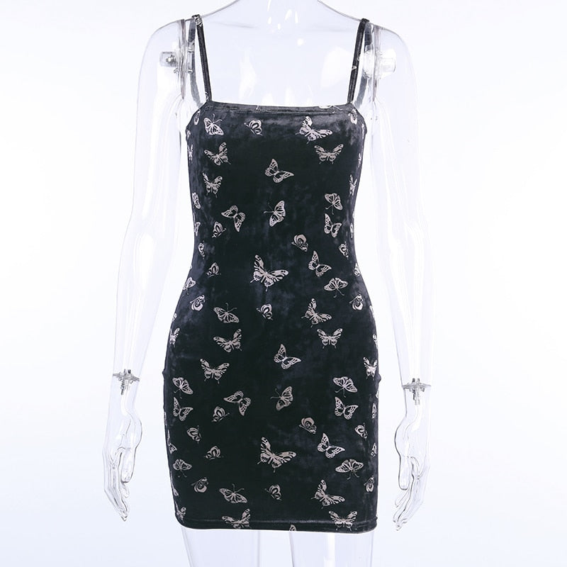 Black velvet butterfly-print mini dress displayed from the front on a clear mannequin.