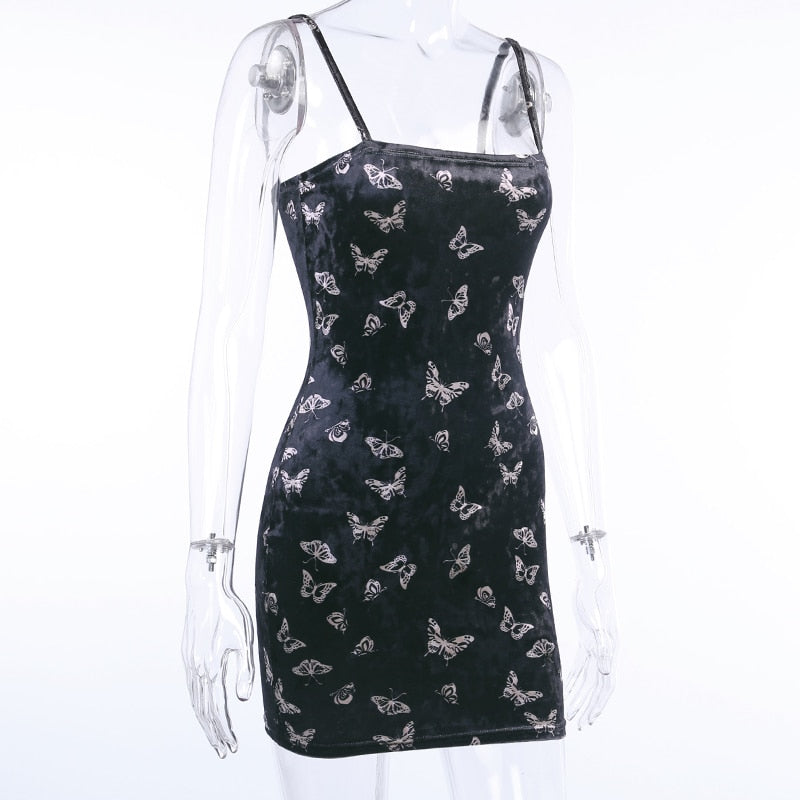 Black velvet butterfly-print mini dress displayed at an angle on a mannequin.