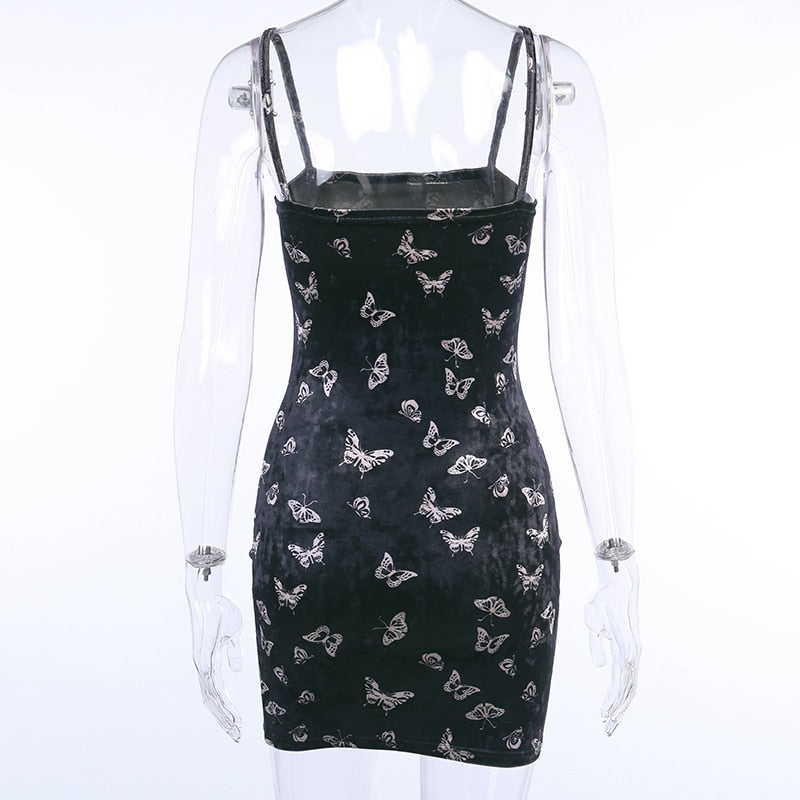 Black velvet butterfly-print mini dress displayed from the back on a mannequin.