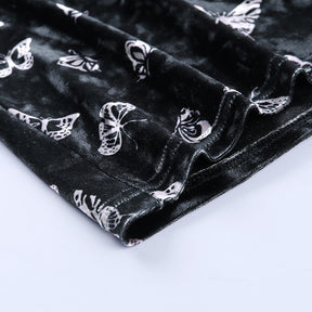 Black velvet butterfly-print mini dress with a close view of the lower hem.