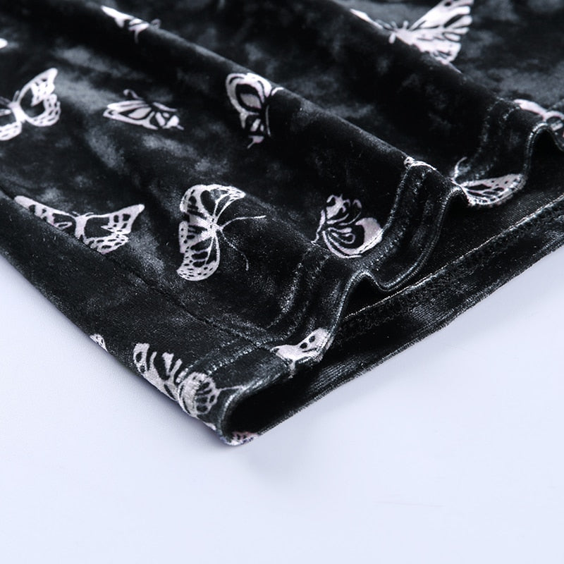 Black velvet butterfly-print mini dress with a close view of the lower hem.