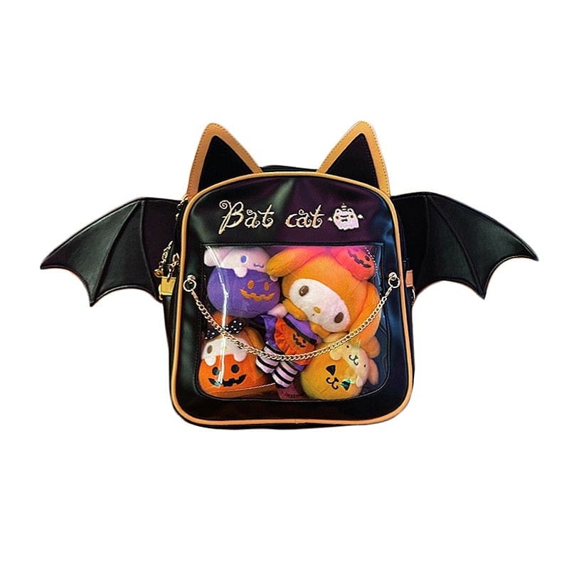 Cat-ear bat-wing backpack isolated against white, showing golden-orange edging, Bat cat lettering and a clear pocket filled with Halloween-themed display plushies.