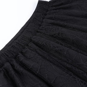 Stitching and gathered fabric at the back of the black spiderweb tutu waistband.