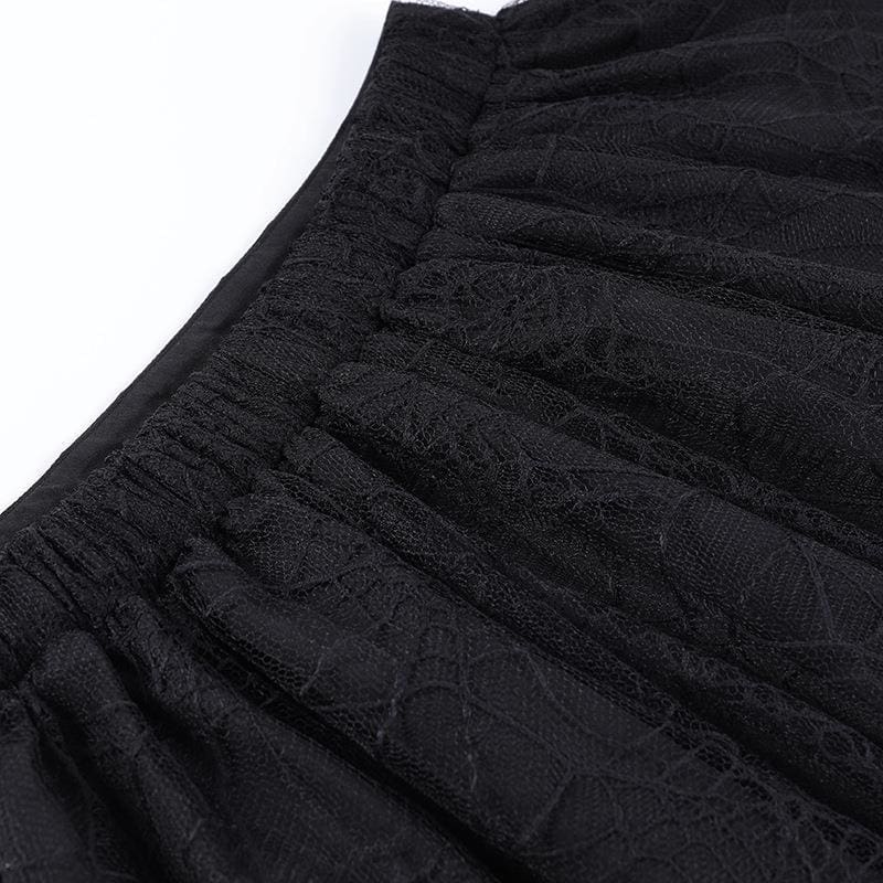 Stitching and gathered fabric at the back of the black spiderweb tutu waistband.