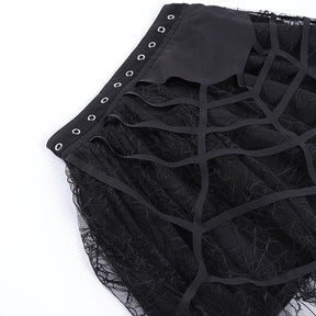 Close-up of the black fabric web layered over fine net lace on the tutu skirt.
