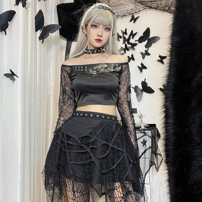 Front view of the layered black web skirt in an outfit with an off-shoulder top.