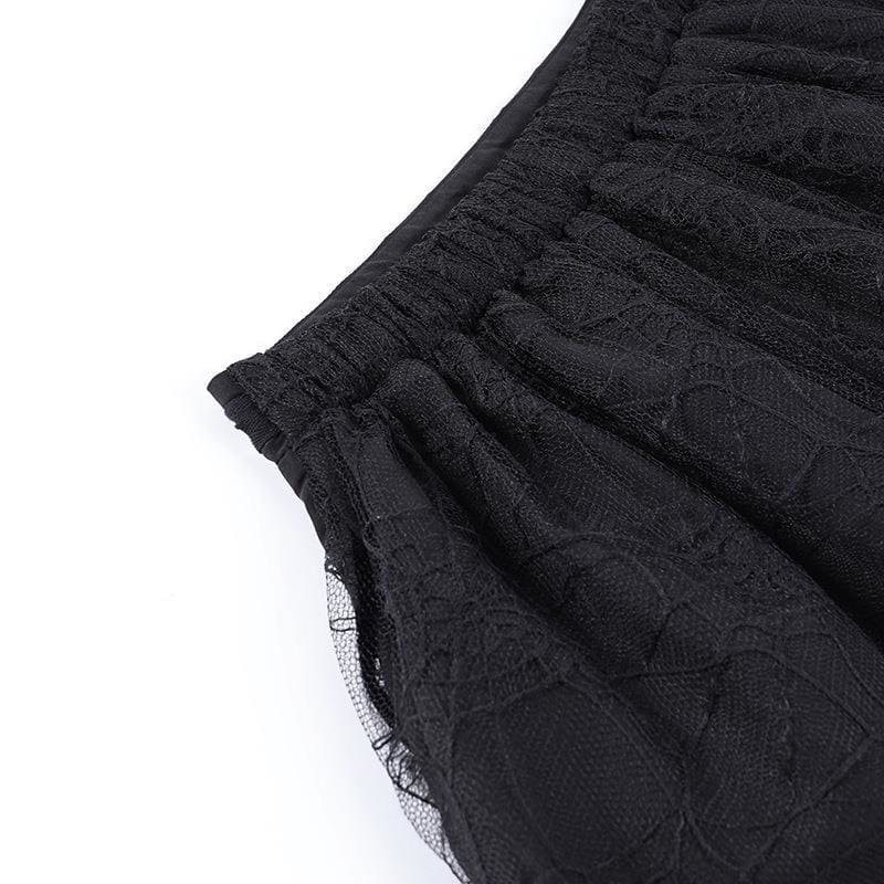 Close-up of the gathered elastic back waistband on the black lace skirt.