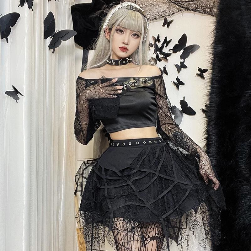 Cobweb tutu skirt in a gothic outfit with a lace sleeve crop top and choker.